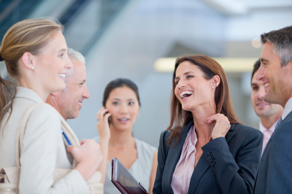 Business professionals having a positive interaction in a networking environment.